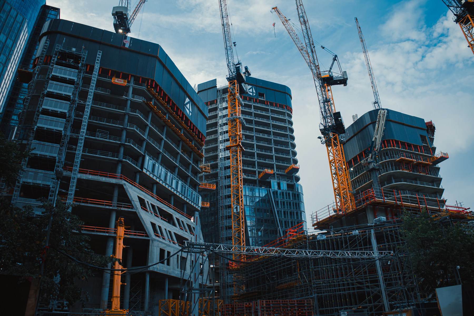 Urban construction site with cranes and buildings under development